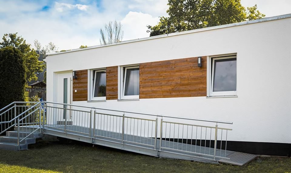 The New Care Mobile as a living container with stairs and ramp.